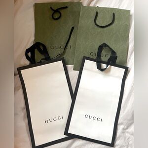 Various Gucci Shopping Bags & a Drawstring bag